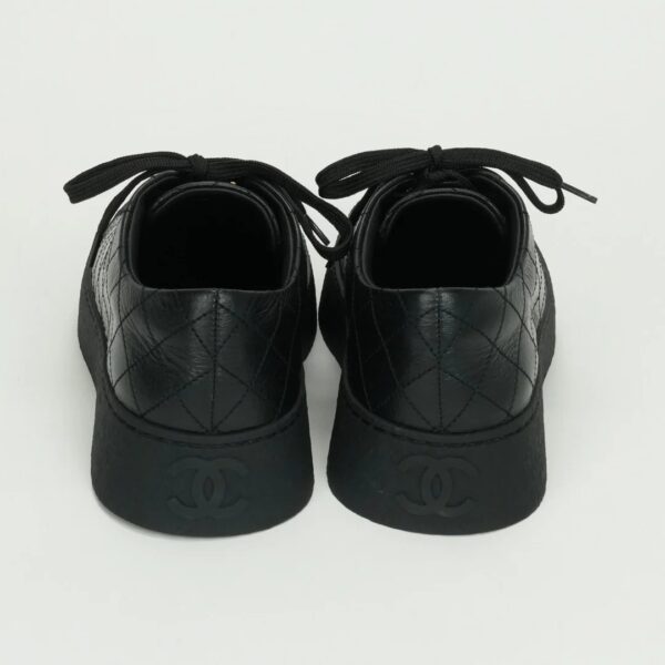 CHANEL Black leather sneakers