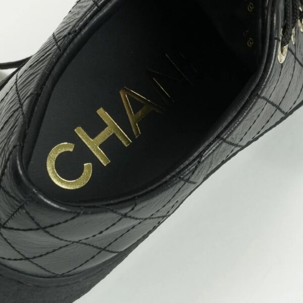CHANEL Black leather sneakers